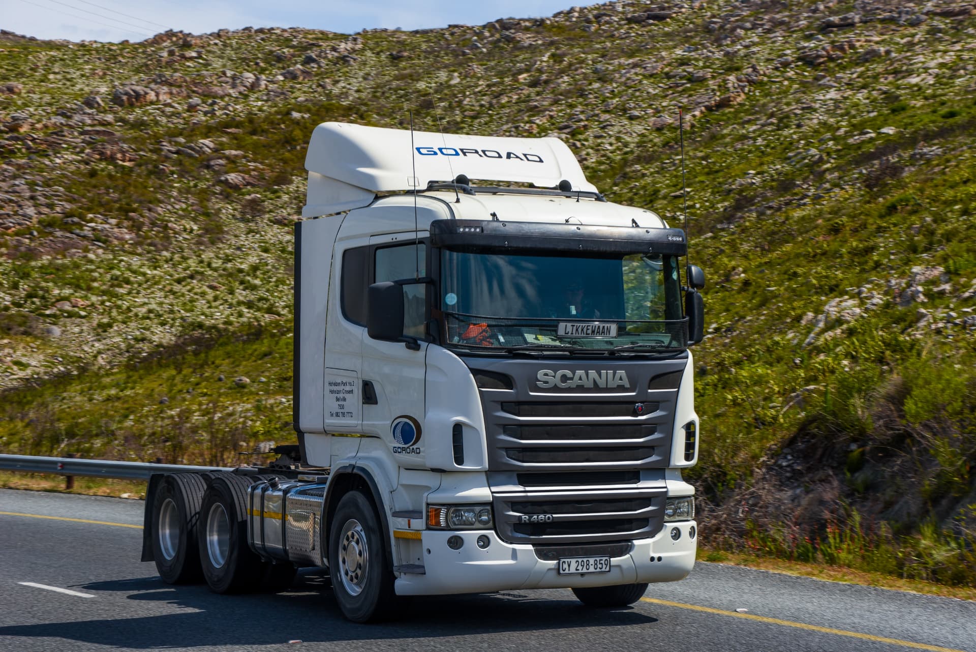 A container truck on the road delivering cargo direct to the receiver.
